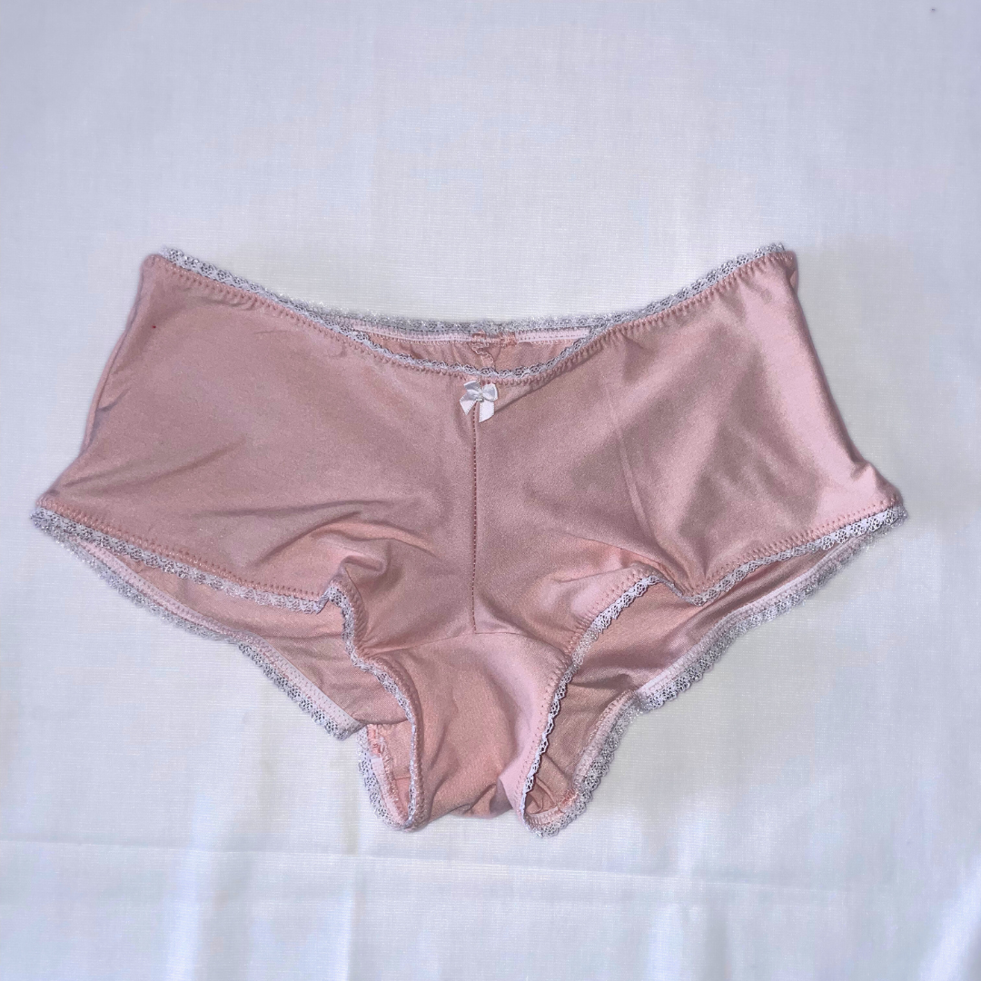 This image features the Daphne Bootyshort in Solids, showcasing a sleek and sophisticated design. The bootyshort is crafted from a high-quality, soft rayon lycra blend, presenting a comfortable and buttery-soft feel.