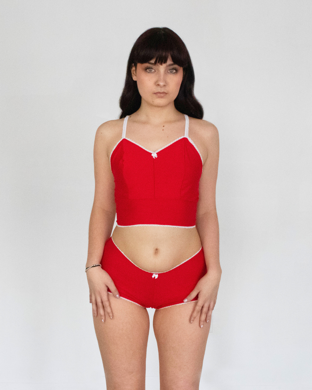 This image features the Daphne Bootyshort in Solids, showcasing a sleek and sophisticated design. The bootyshort is crafted from a high-quality, soft rayon lycra blend, presenting a comfortable and buttery-soft feel.