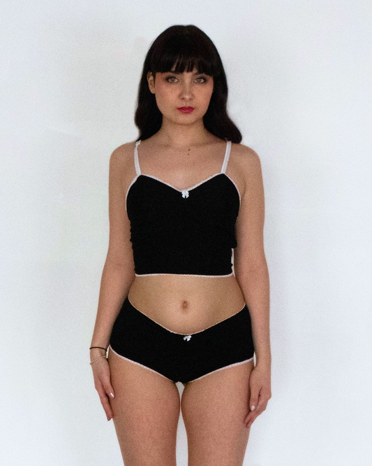 This image features the Daphne Bootyshort in Solids, showcasing a sleek and sophisticated design. The bootyshort is crafted from a high-quality, soft rayon lycra blend, presenting a comfortable and buttery-soft feel.