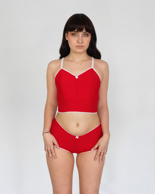 This image features the Daphne Bootyshort in Solids, showcasing a sleek and sophisticated design. The bootyshort is crafted from a high-quality, soft rayon lycra blend, presenting a comfortable and buttery-soft feel.